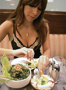 Lebanese girl eating hommos